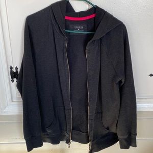 Black hooded zip up jacket.